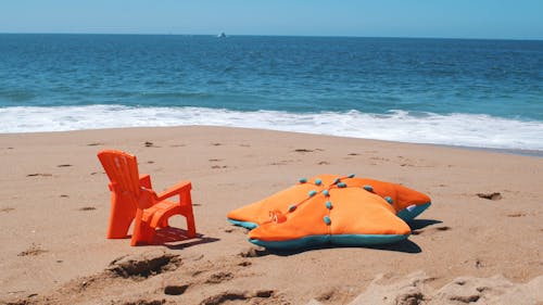  Chair abd Pillow on the Beach Sand
