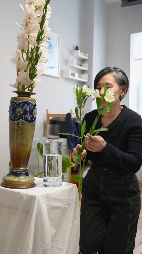 Florist Arranging a Vase