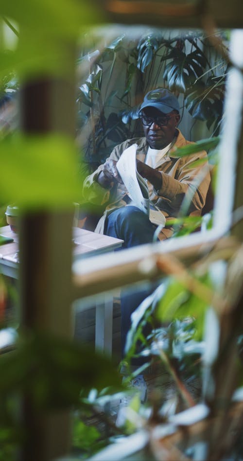 Selective Focus Video of Man Reading News Paper