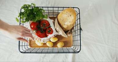 bread and vegetables in a basket