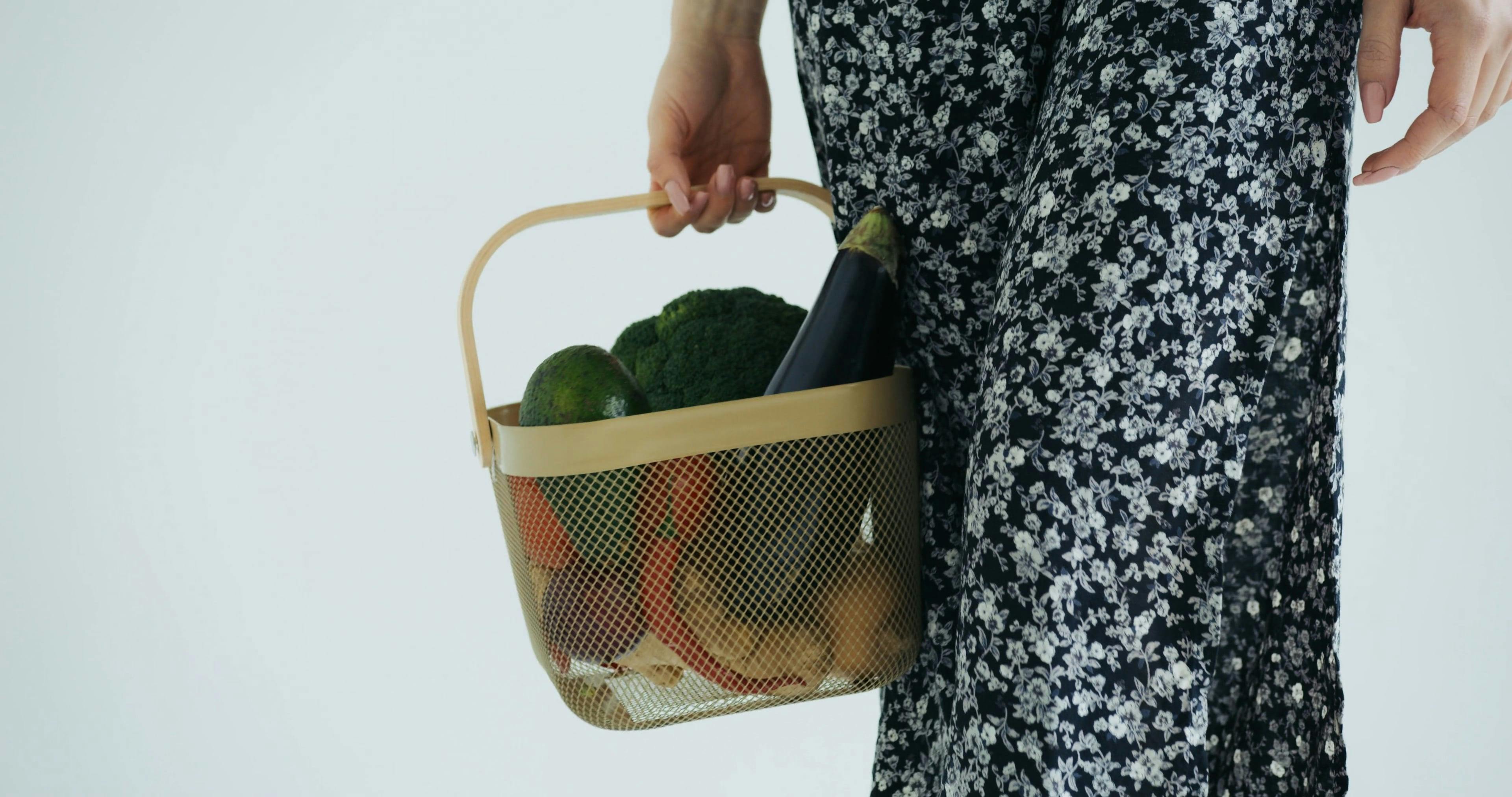 Woman Carrying a Basket with Vegetables · Free Stock Video