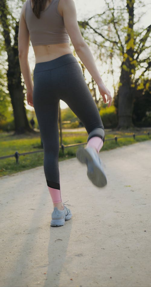 A Woman Stretching Before Running