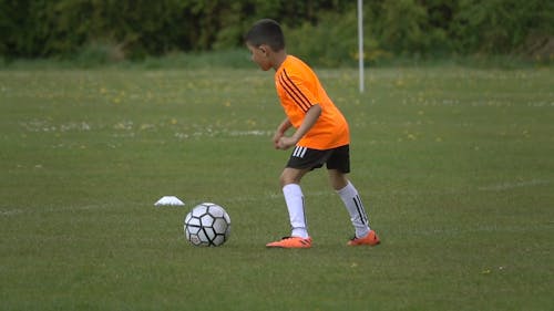 Boy Playing Soccer