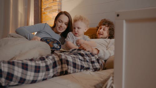 Family Together In Bed