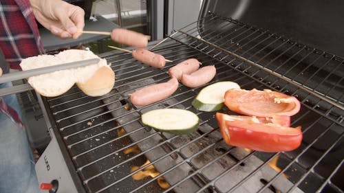 Person Grilling Food