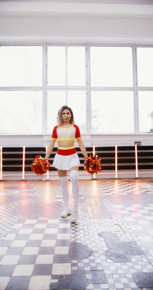 Cheerleader Dancing with Pompoms