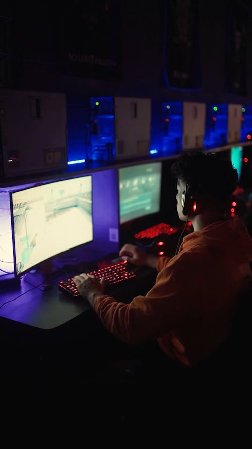 A Boy Playing A Computer Game