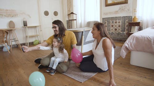 Man Taking Selfie with Family