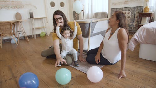 Family Playing with Balloons