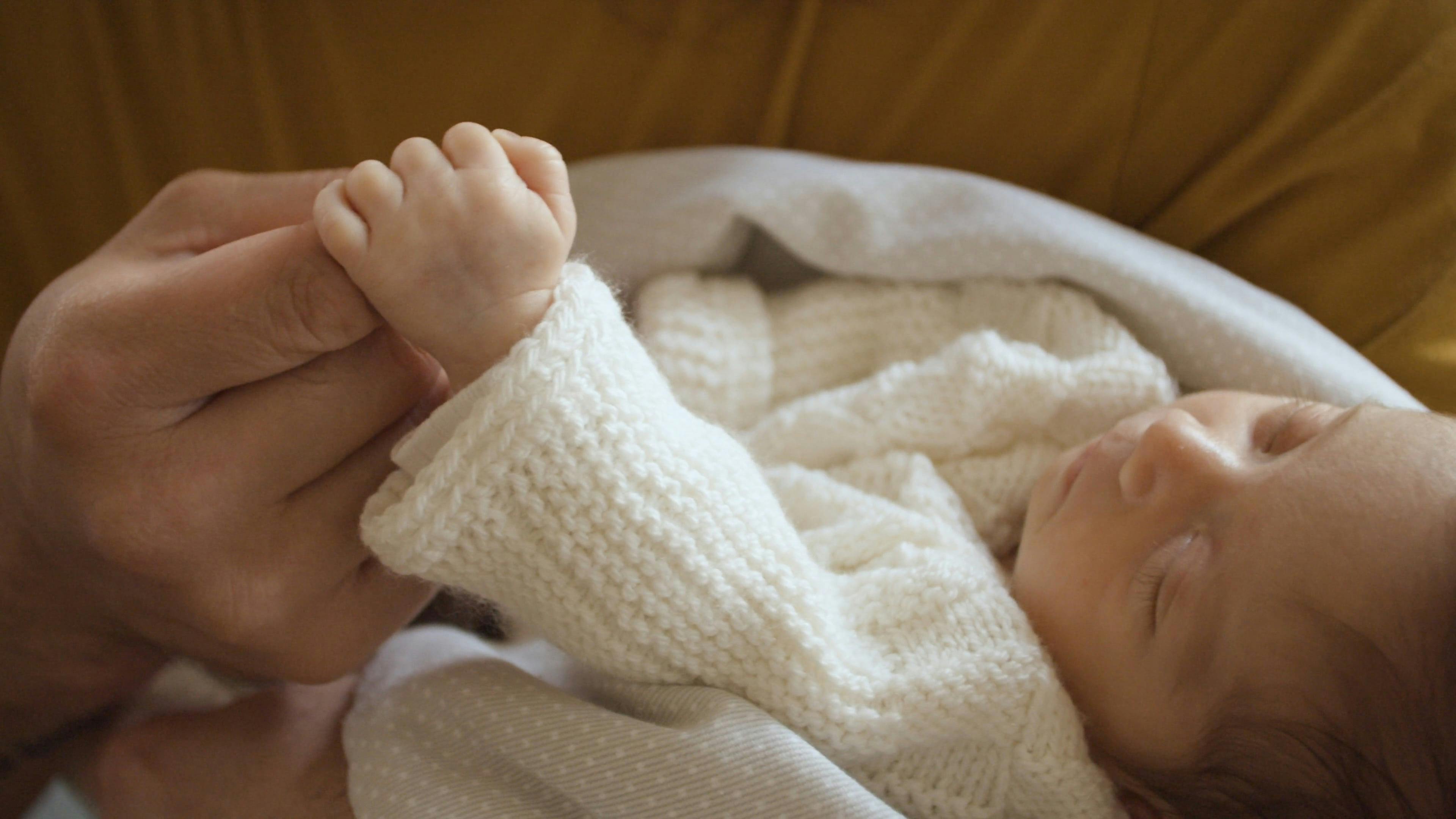 Newborn Baby Holding the Finger of a Person · Free Stock Video