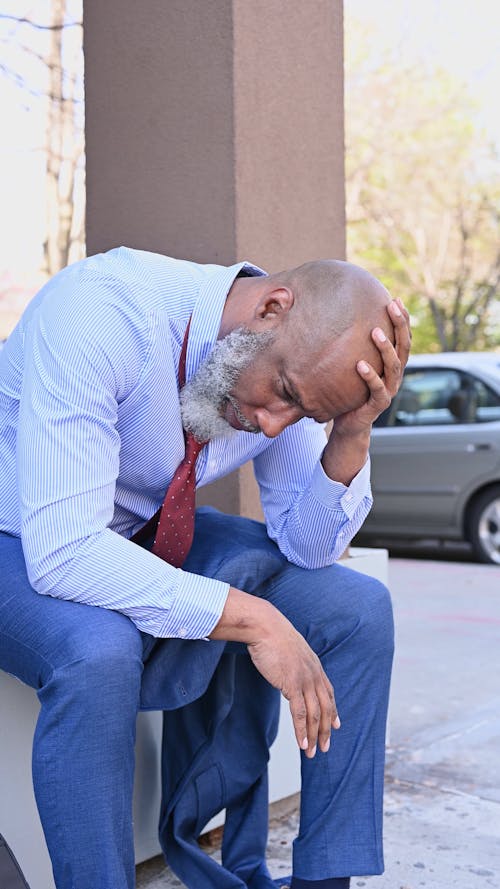 Sad Man Touching His Head