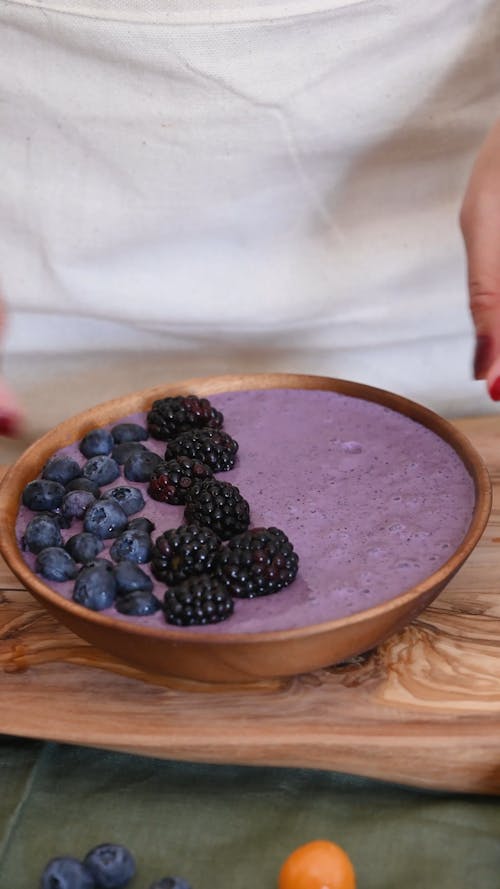 Person Preparing  Blueberry Dessert