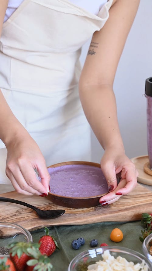 Woman Cleaning Bowl Edge