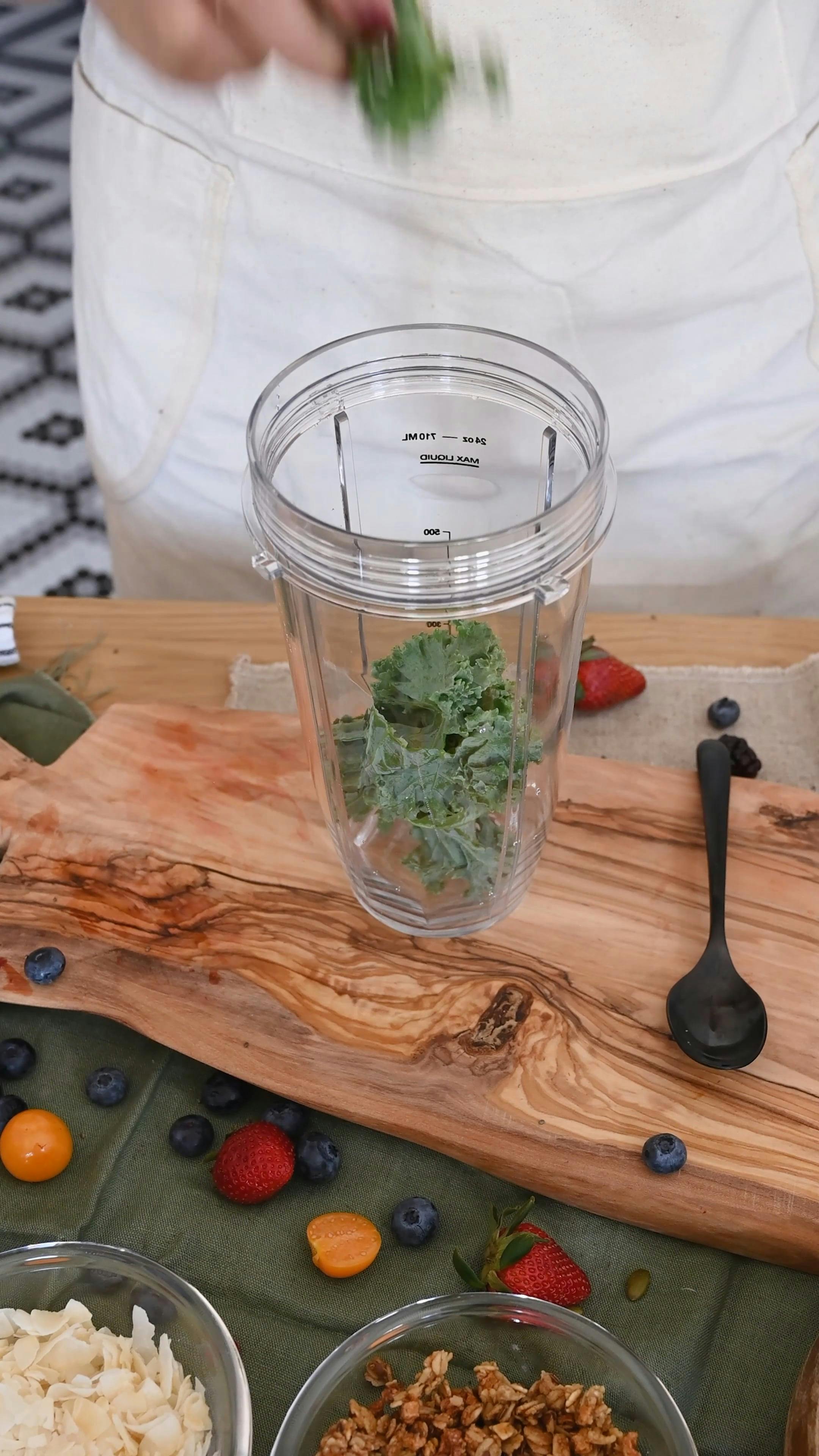 A Person Putting Kale in a Blender Free Stock Video Footage, Royalty