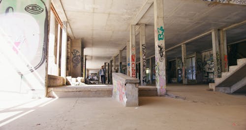 Man Jumping on a Ledge with a Skateboard