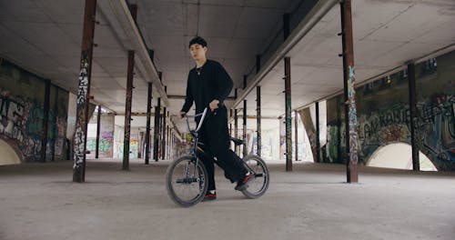 Man Doing Bunny Hops on a BMX Bike