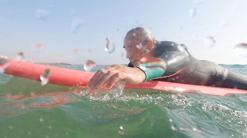 An Old Man Surfing