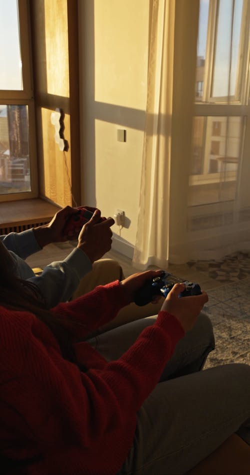 People Holding Game Controller