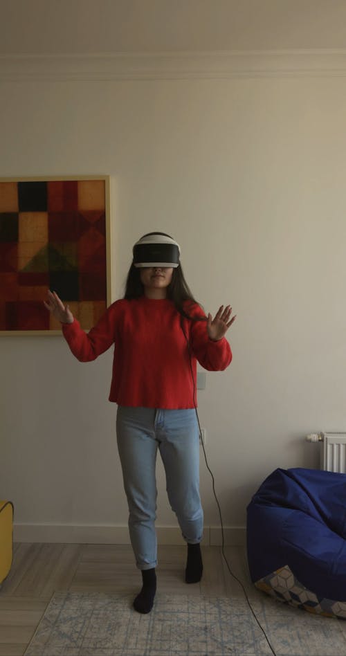 Woman Using a Virtual Headset at Home