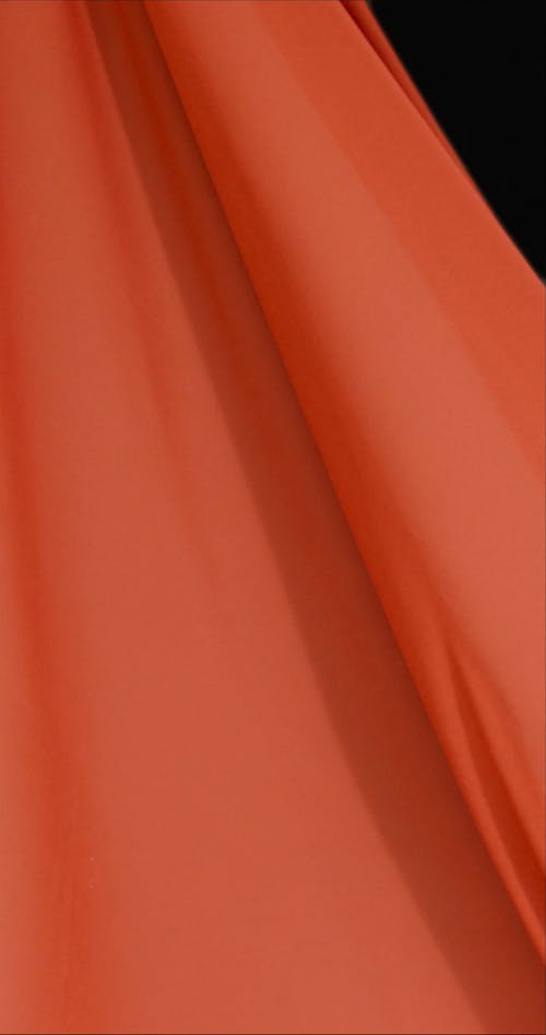 Orange Fabric Blowing In Wind