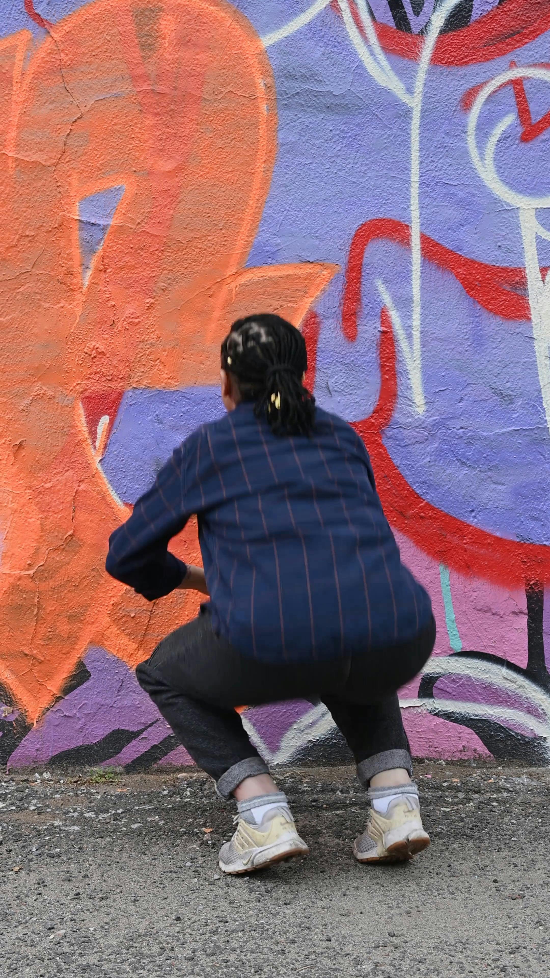 A Person Spray Painting a Wall · Free Stock Video