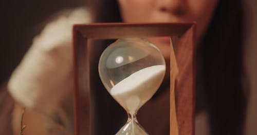 A Woman Looking in an Hourglass
