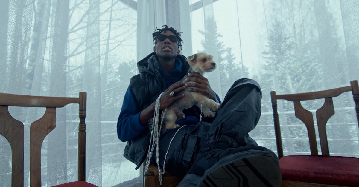 A Man Rapping while Holding His Dog · Free Stock Video