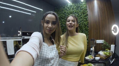 Female Food Bloggers Talking in Kitchen