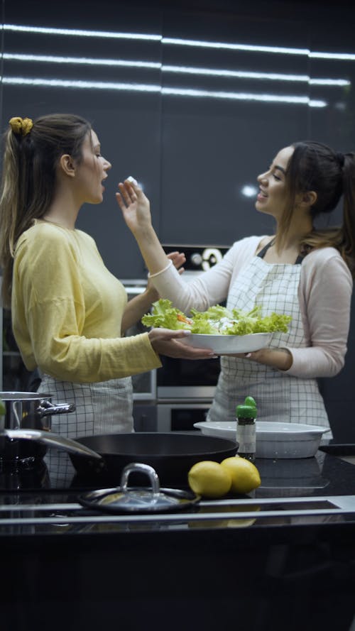 Happy Girls Preparing Food in Kitchen