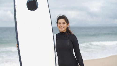 Woman Posing With A Surfboard