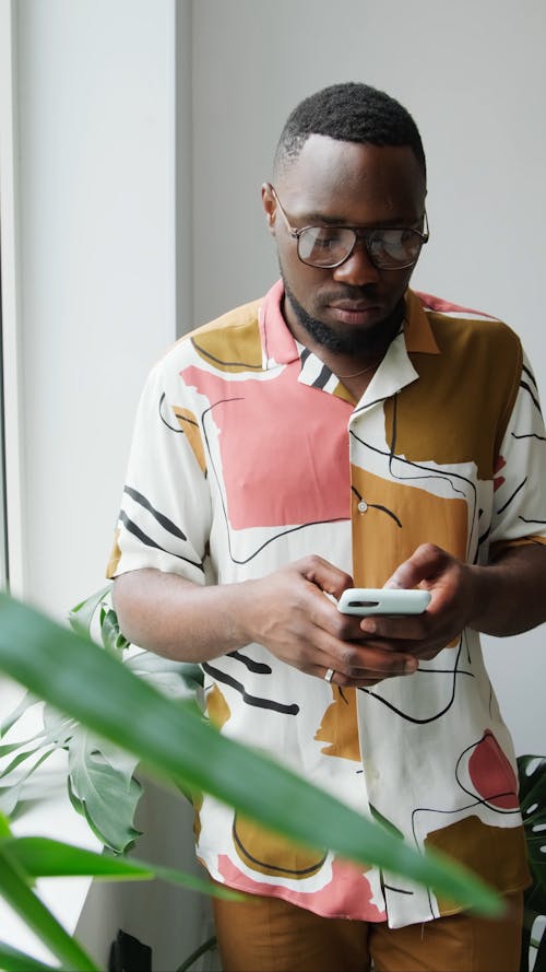 Man Texting on his Mobile Phone