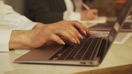 Person Typing on a Laptop