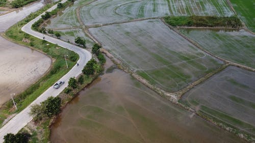 Aerial View of a Agricultural Field with a Road on the Side