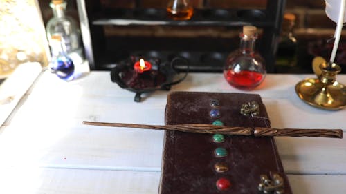 A Magic Wand and Book on a Table