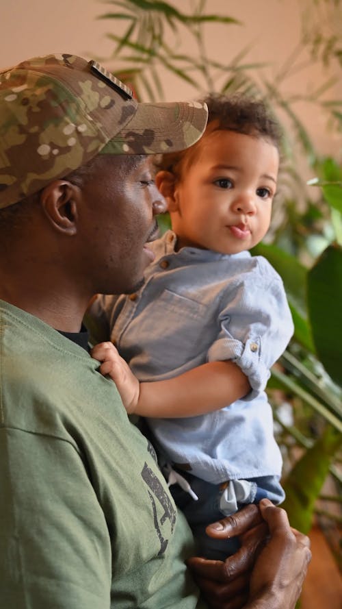 Adult Holding Toddler on Lap