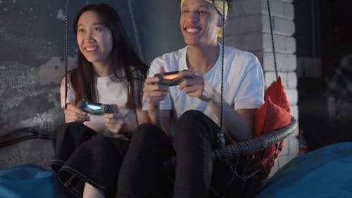 Man and Woman Playing Video Game