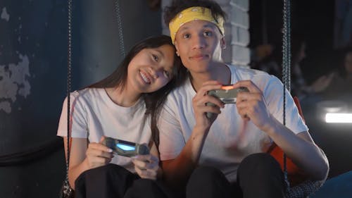 Man and Woman Playing Video Game