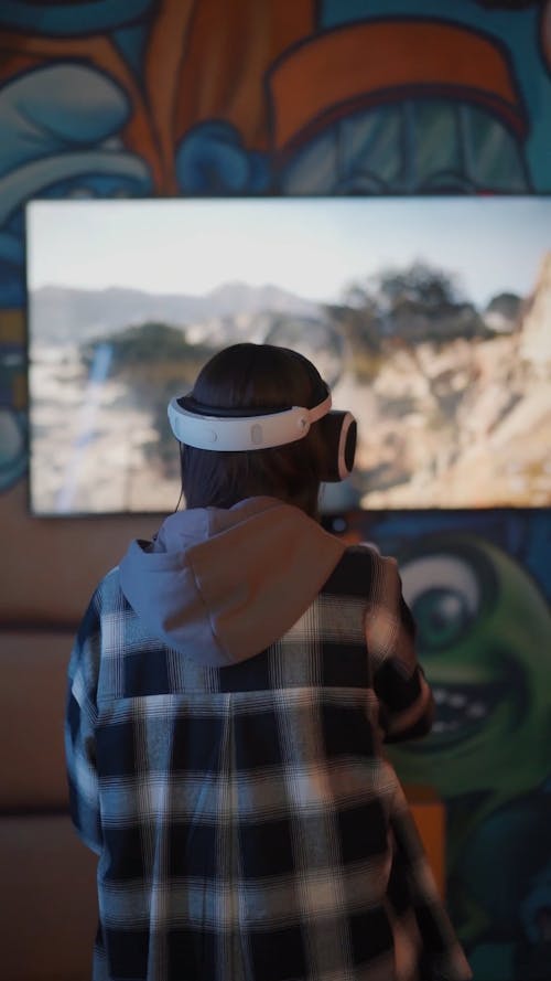 Woman Playing while using Virtual Reality Headset