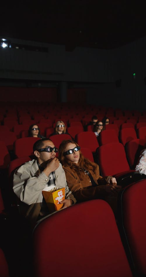 People Watching a Movie Inside a Cinema