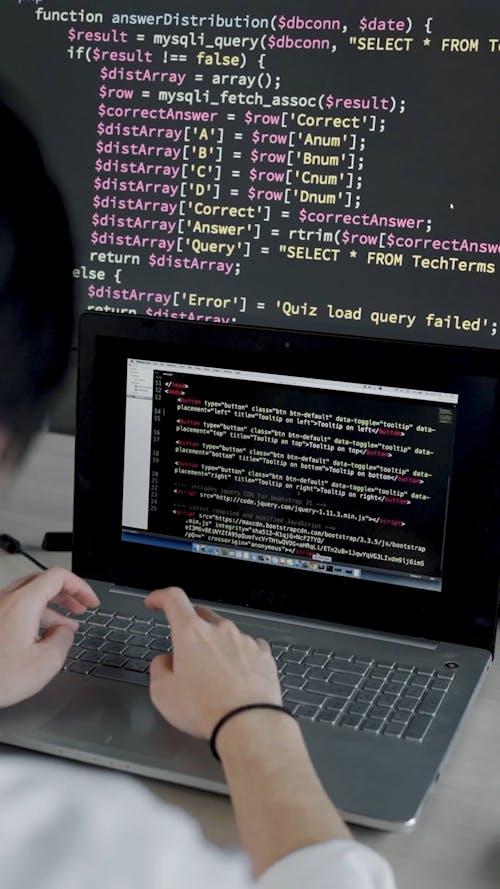 A Man Typing on the Laptop