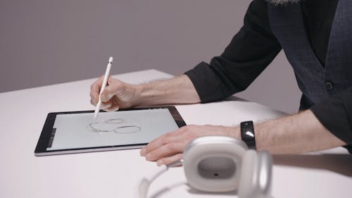 A Designer Using a Digital Tablet 