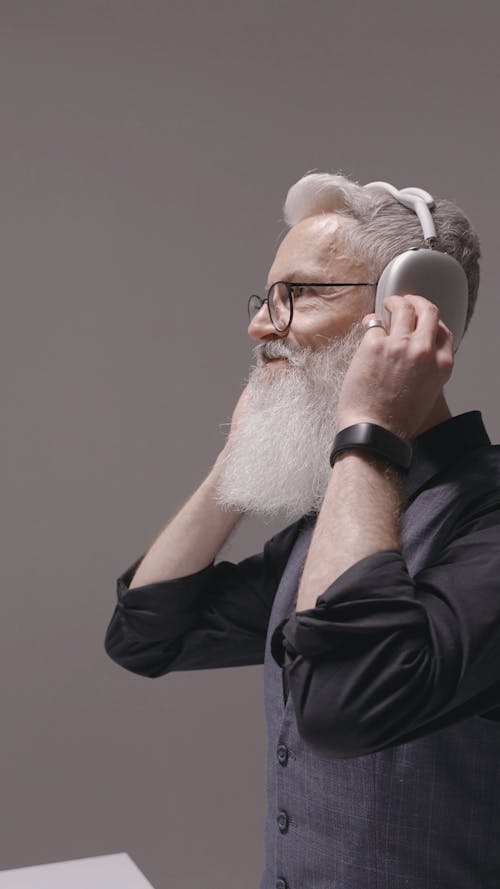 Man With Beard Testing Headphones