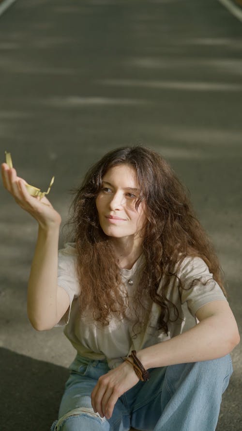 A Woman Holding A Compass
