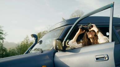 woman holding binocular