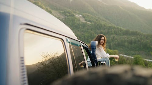 Woman Sitting on the Car