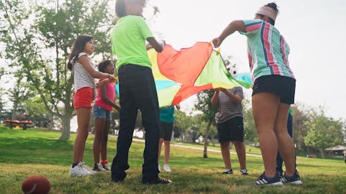 People Playing a Parachute Game