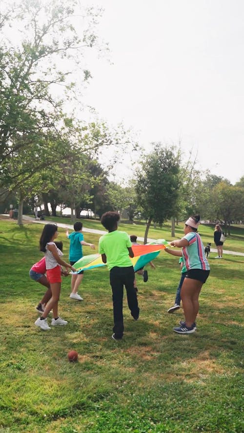 Children Playing a Parachute Game