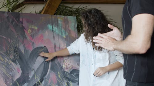 Woman Showing the Painting to a Man