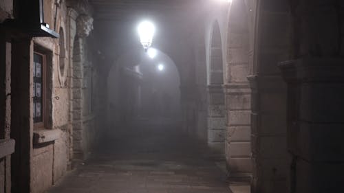 A Video Footage of an Alley at Night with Lights