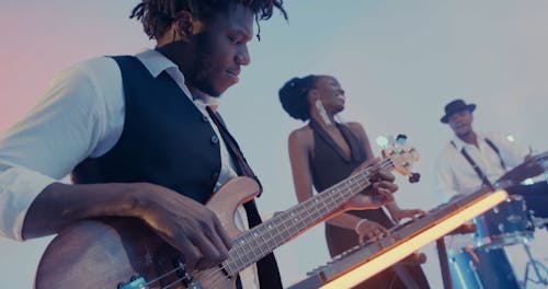 The Band Playing Their Musical Instruments